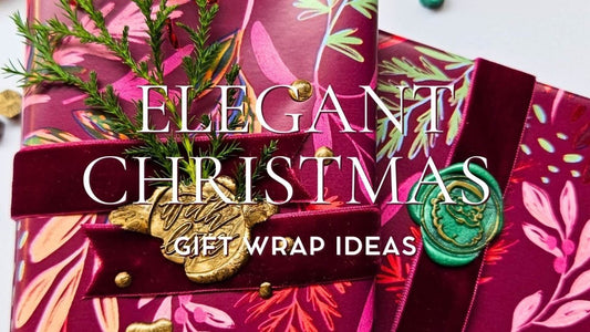 Christmas presents wrapped with mulberry velvet ribbon and green and gold wax seals