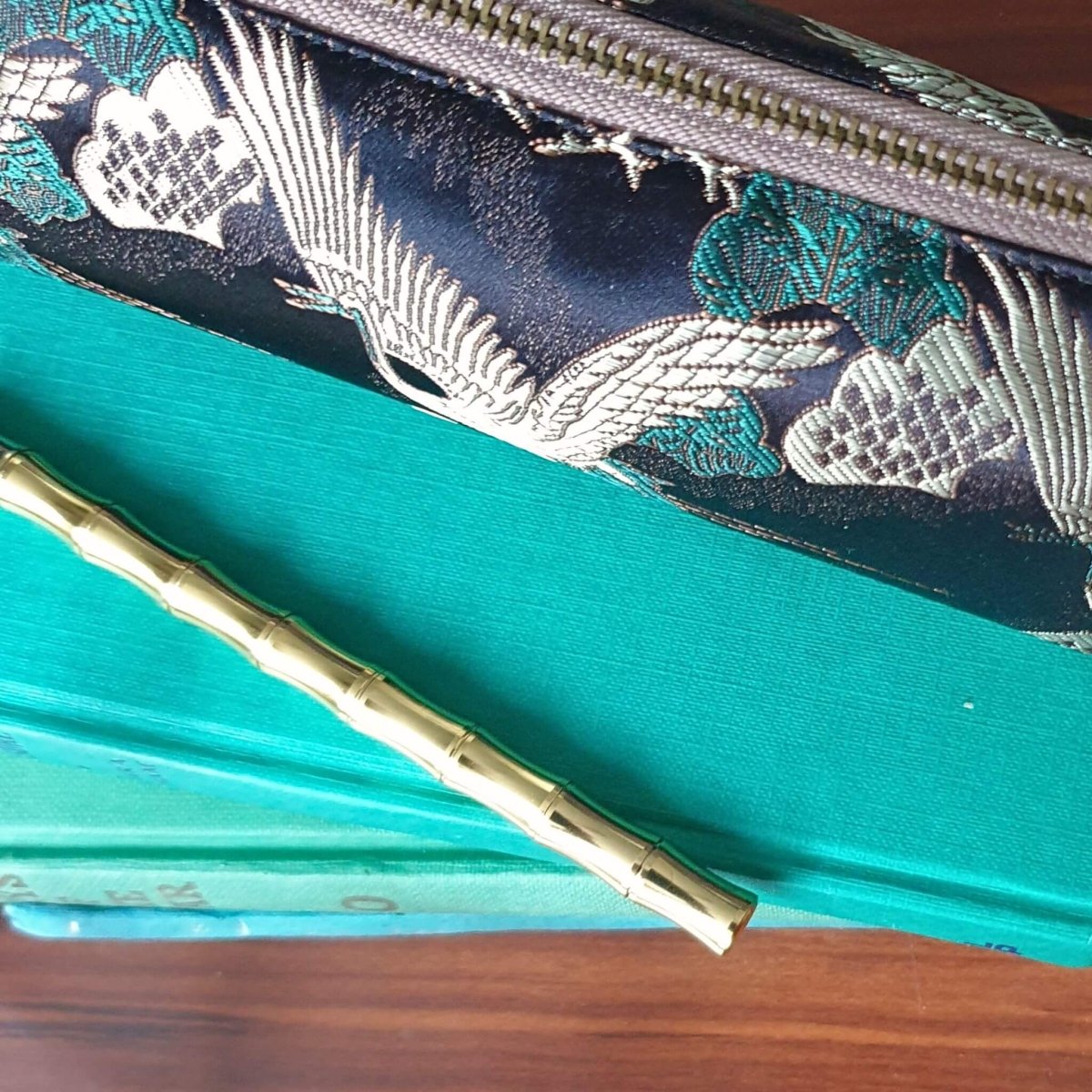 Bamboo shaped gold Brass Pen on book - Bounde