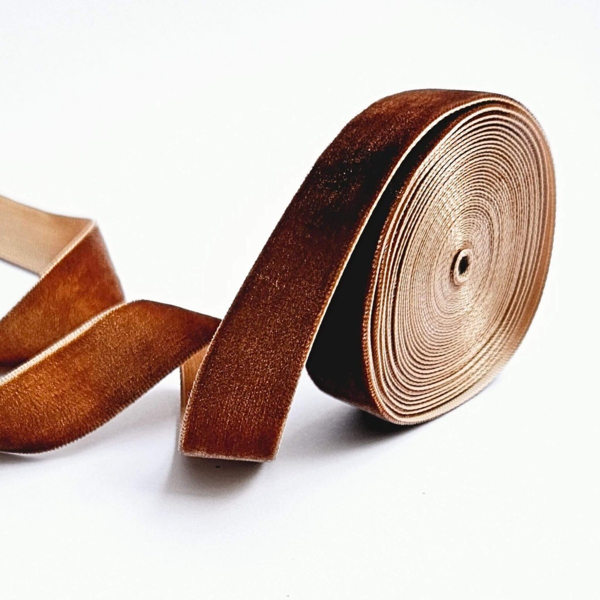 roll of brown velvet ribbon unravelling