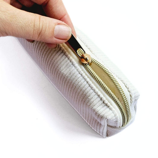 small white corduroy pencil case with hand opening zip