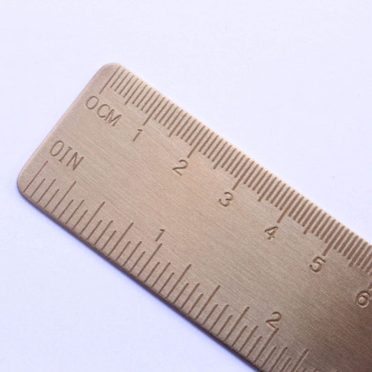 close up of brass ruler bounde