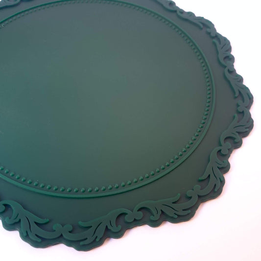 close up of edge detail of green silicone heatproof mat