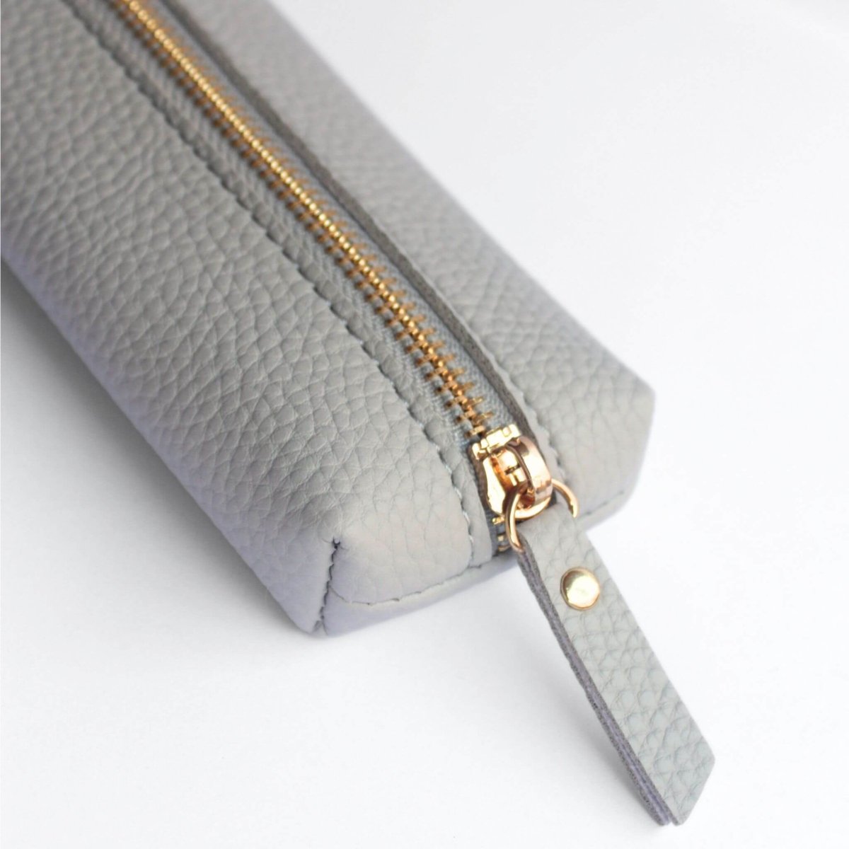 grey vegan leather pencil case with gold zip detail