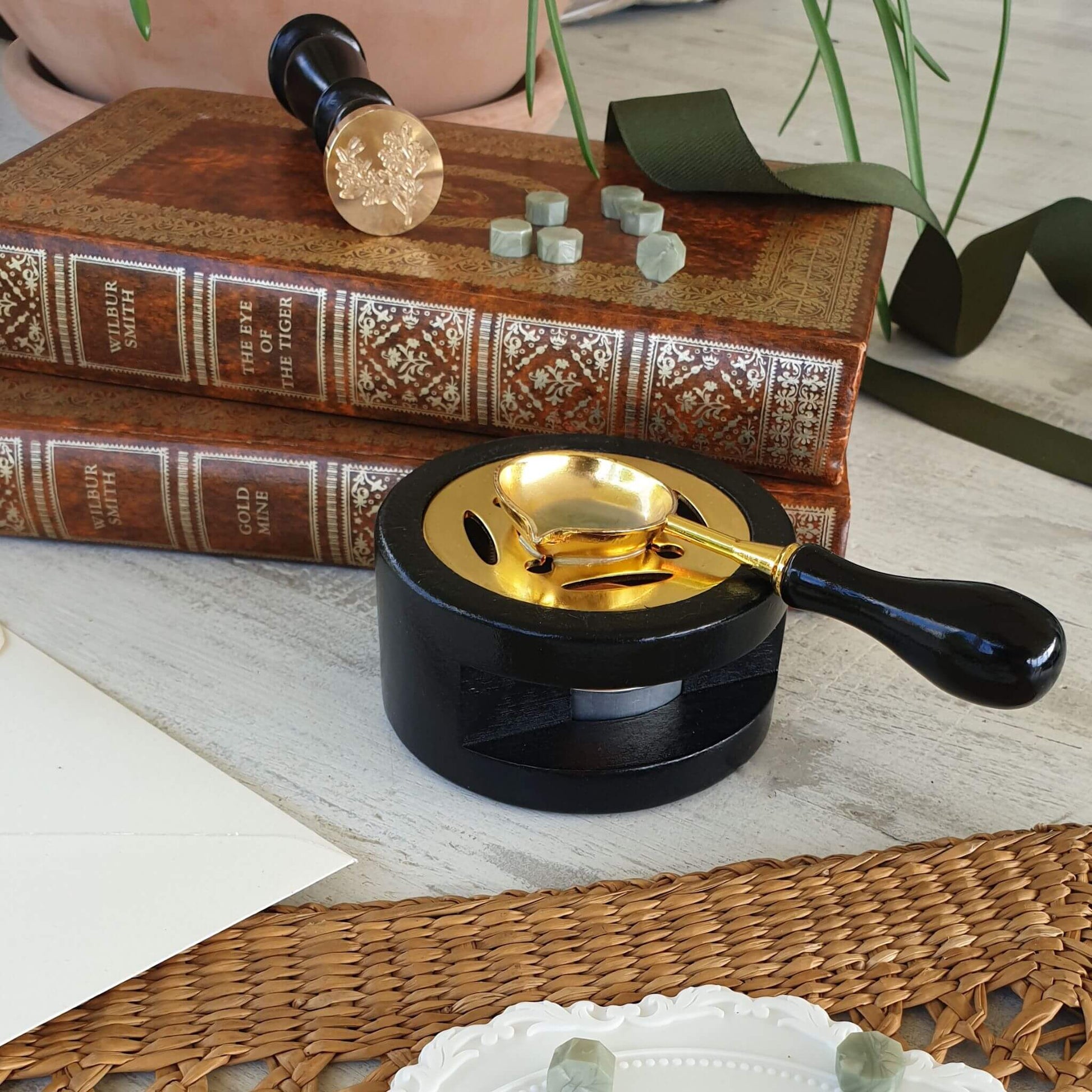 Wax seal with herb foliage engraving on vintage books