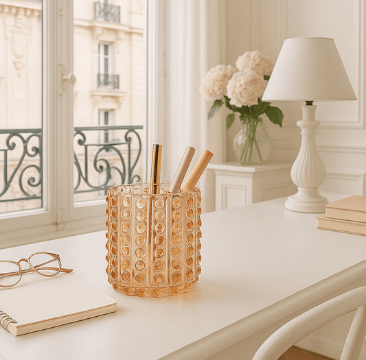 Bubble glass pen holder on white desk in French apartment