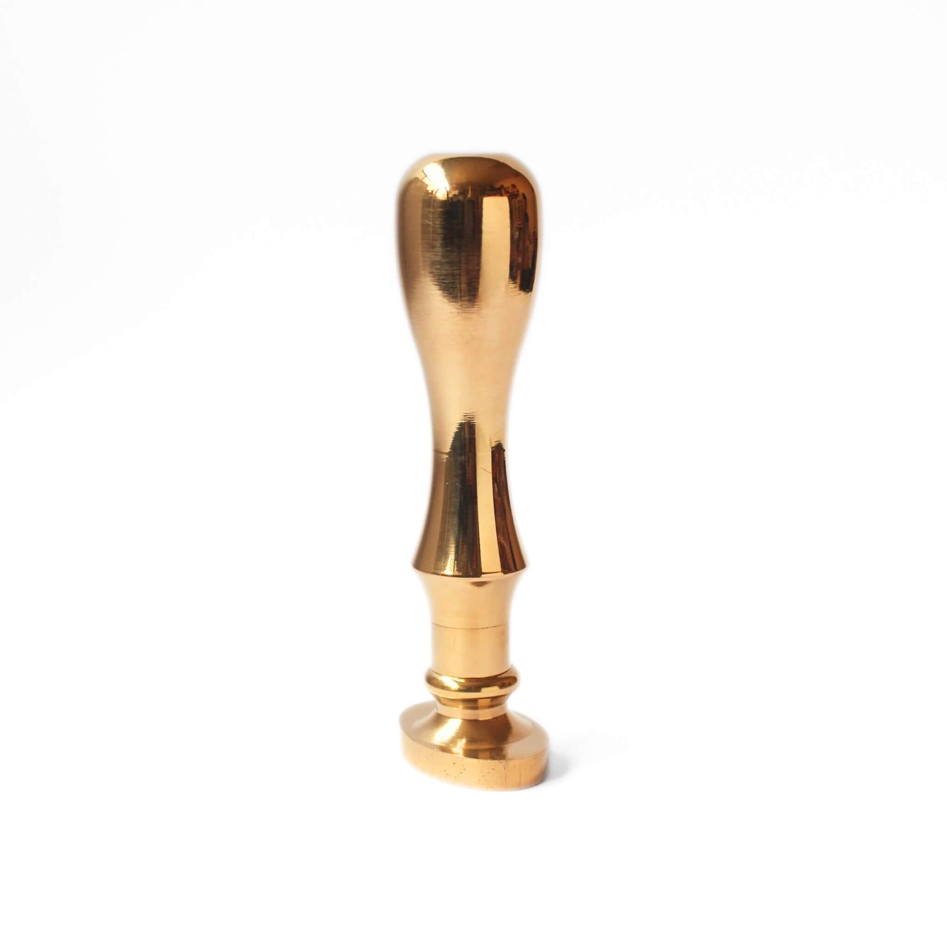 side view of solid brass wax seal with oval shaped stamp head