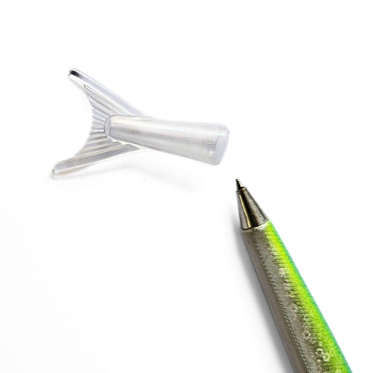 Close-up of a pen with a clear fish tail cap on a white background