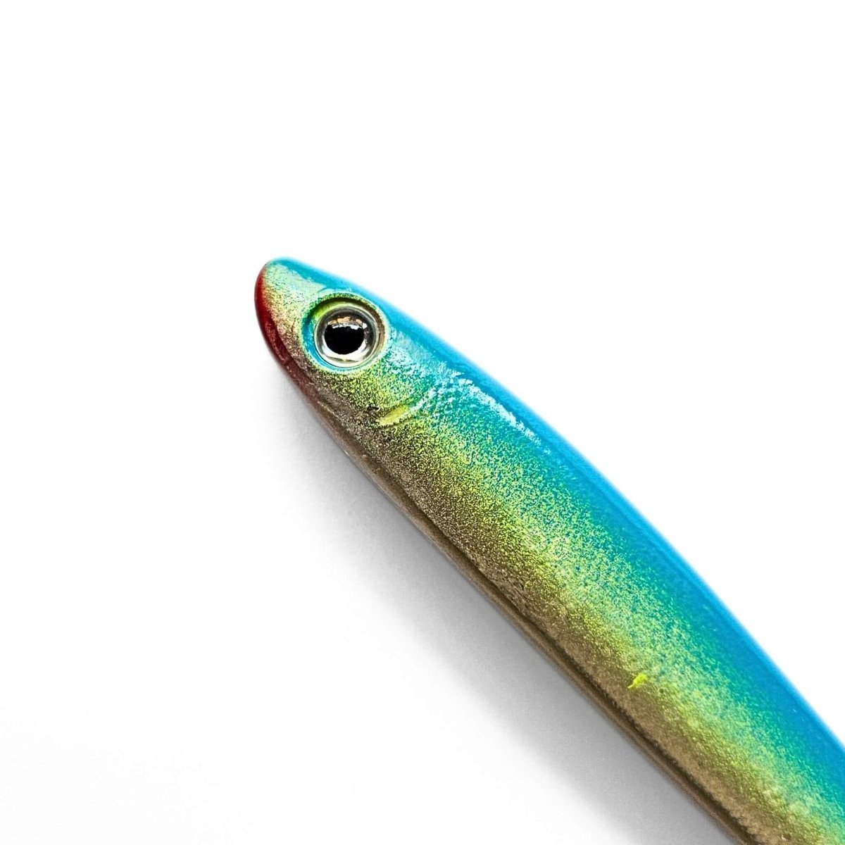 Close-up of a colorful fish-shaped pen on a white background
