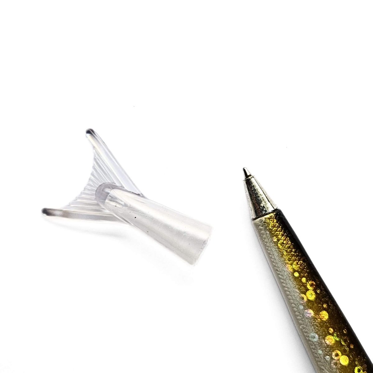 Decorative fisn pen with glittery design on a white background