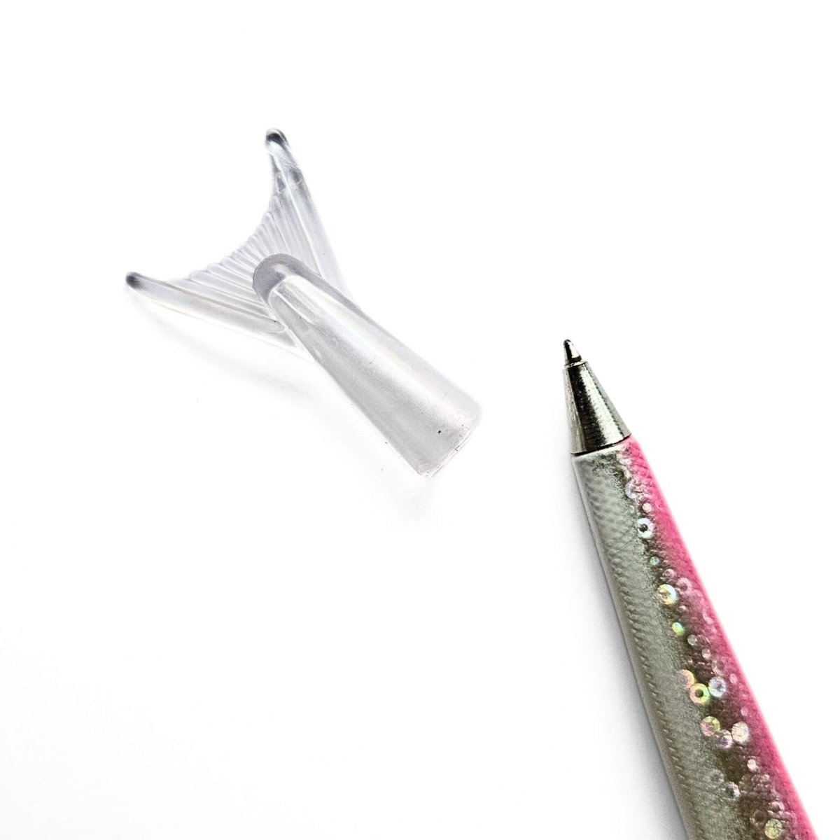 Decorative pen with a pink and silver design on a white background