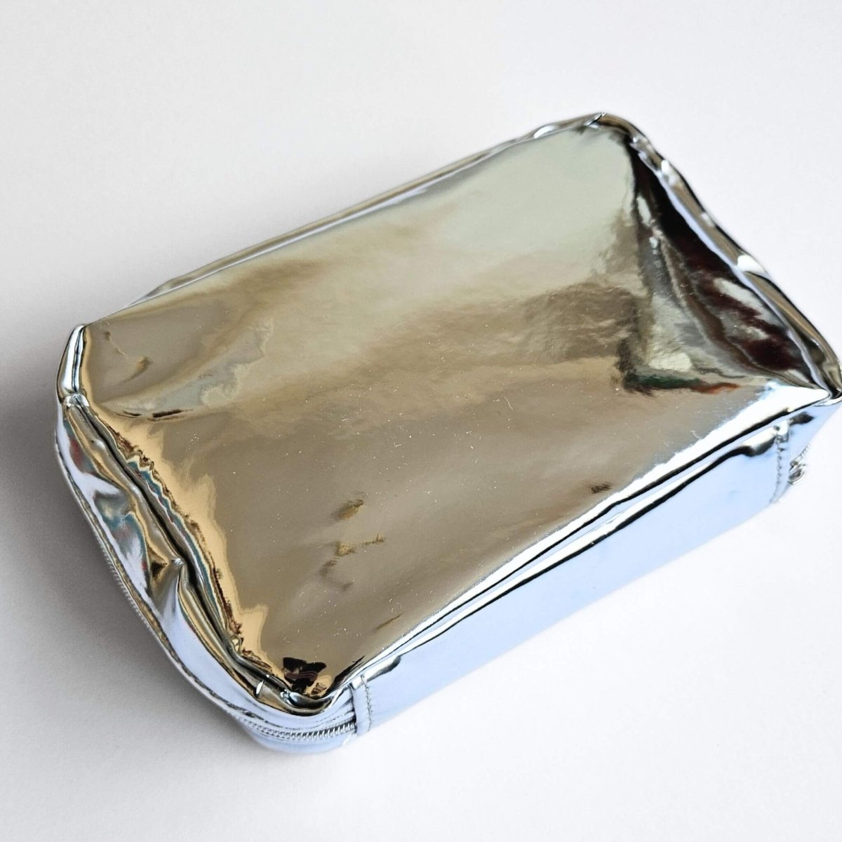 Silver rectangular pen pouch on a white background