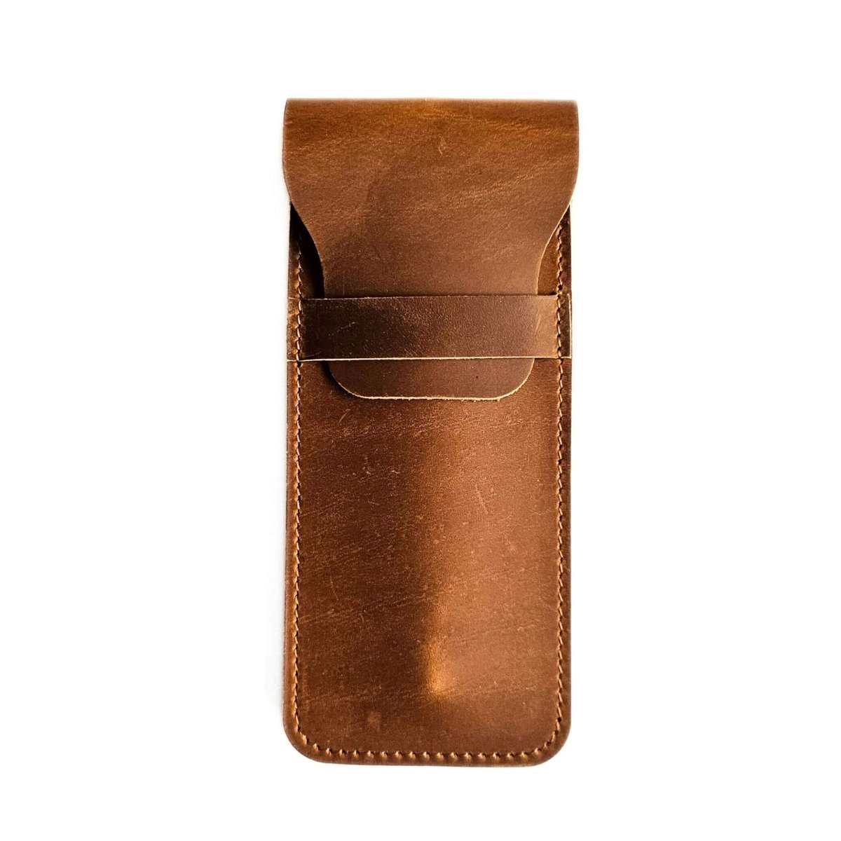 Rustic brown leather pen sleeve on a white background