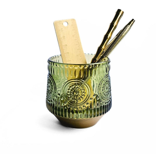 patterned green glass pen organiser with gold stationery inside