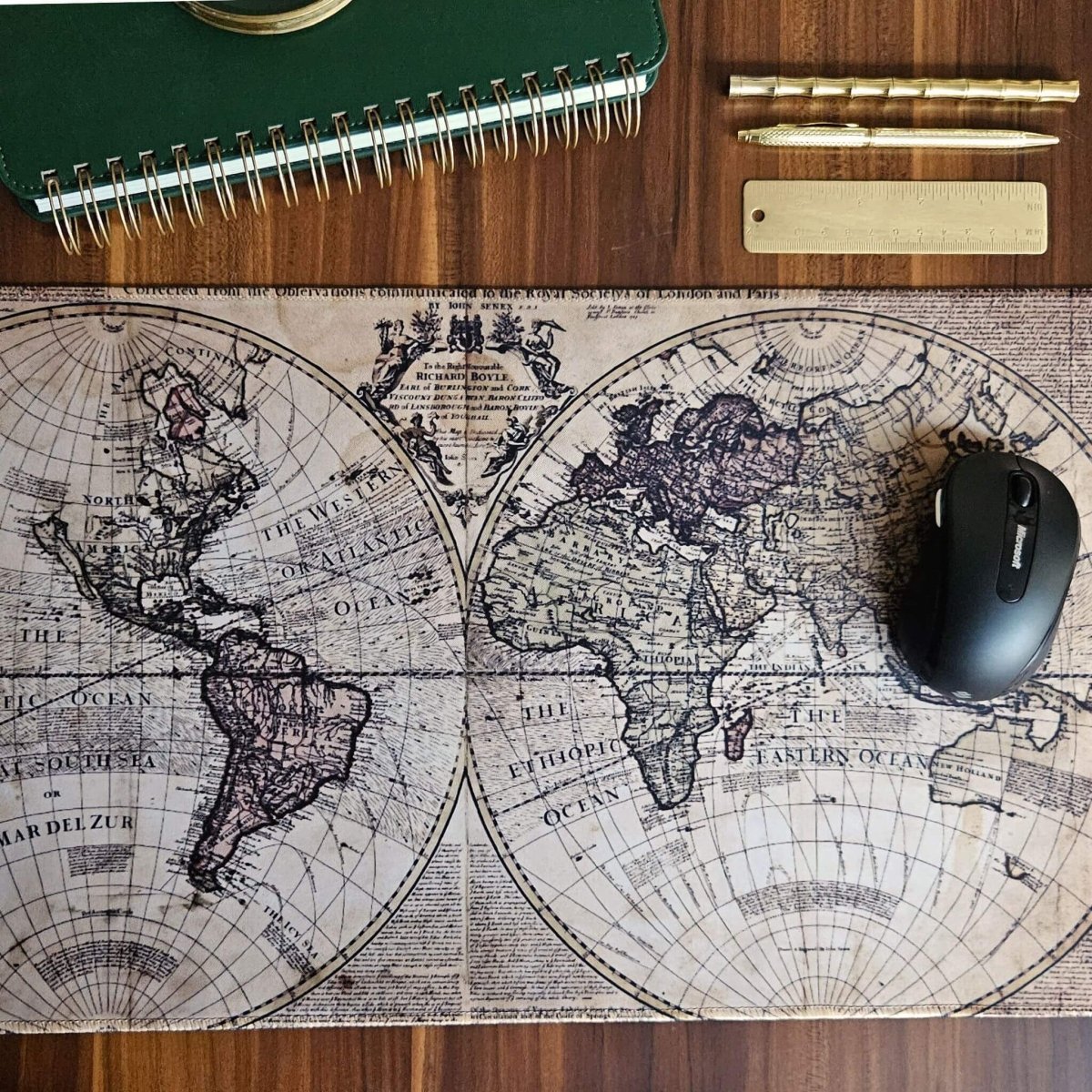 rustic men's world map desk mat on office desk
