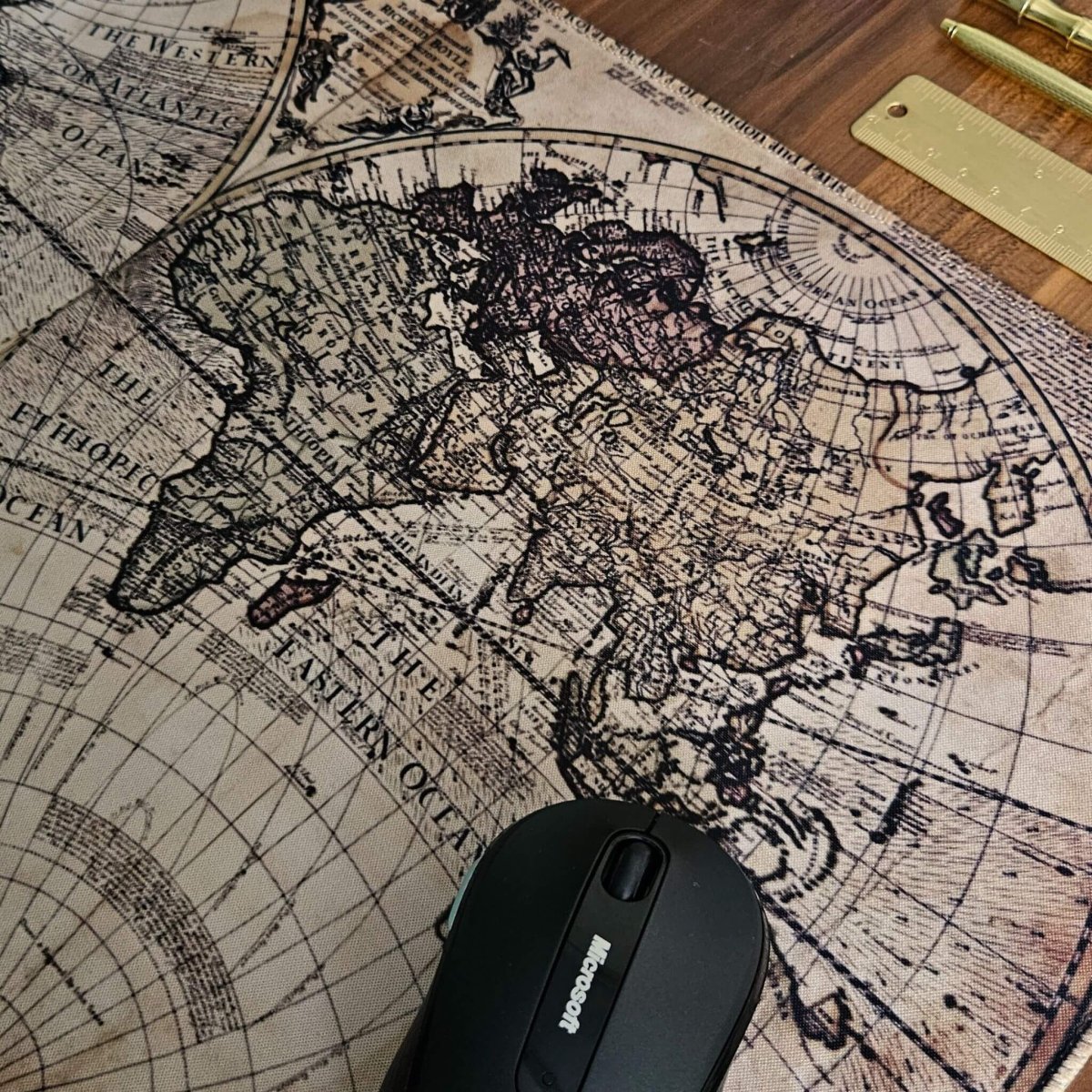 desk mat with vintage globe design in rustic brown shades