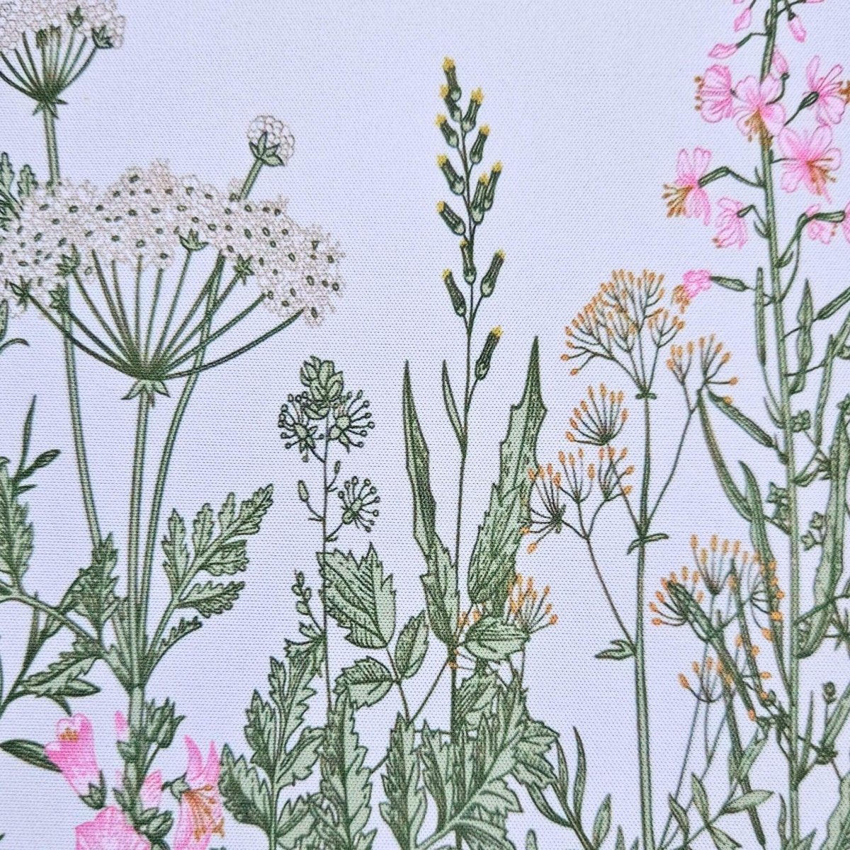 Illustration of various plants and flowers on a white mouse pad