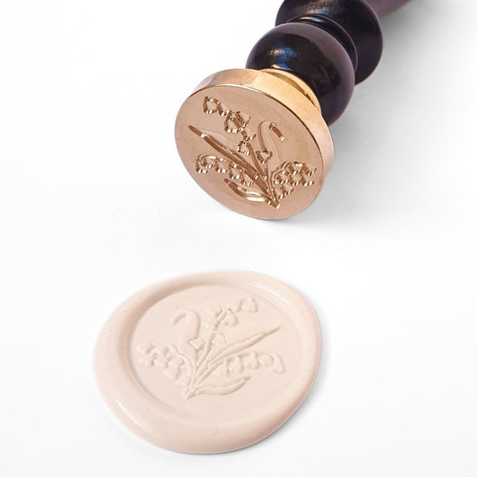 Brass wax seal head with lily of the valley plant engraved and black wooden handle