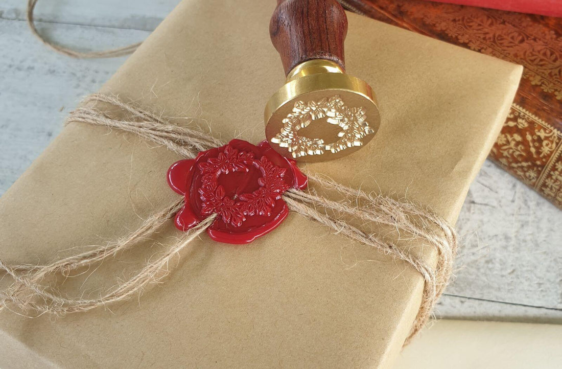 red wax seal over brown string on gift