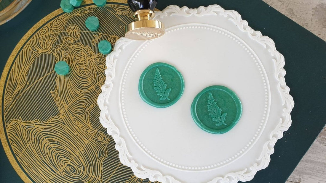 round green wax seals on white wax seal mat