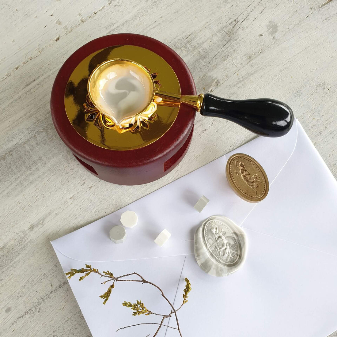 wax seal on wedding invitation envelope and brass wax seal stamp