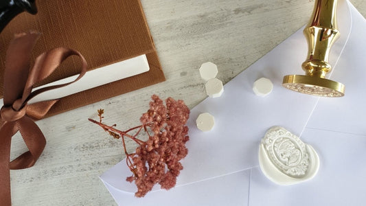 white cameo wax seal and brass wax seal stamp with white sealing wax