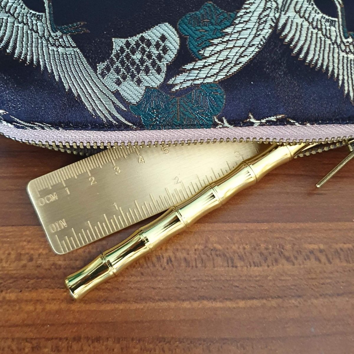 gold bamboo brass pen and brass ruler in pencil case