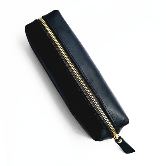 Black leather pencil case with gold zip top view