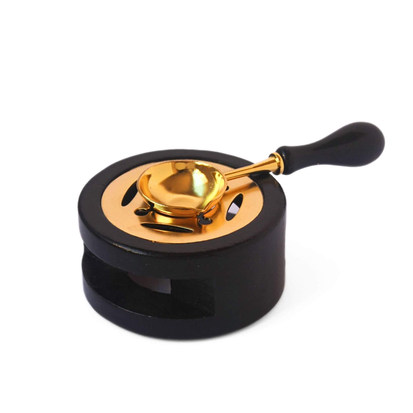 black wood and gold metal wax sealing stove with matching spoon sitting on top on white background