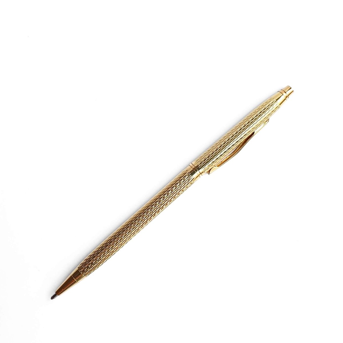 slim gold pen with textured metal casing