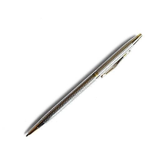 Gold and silver pen on a white background