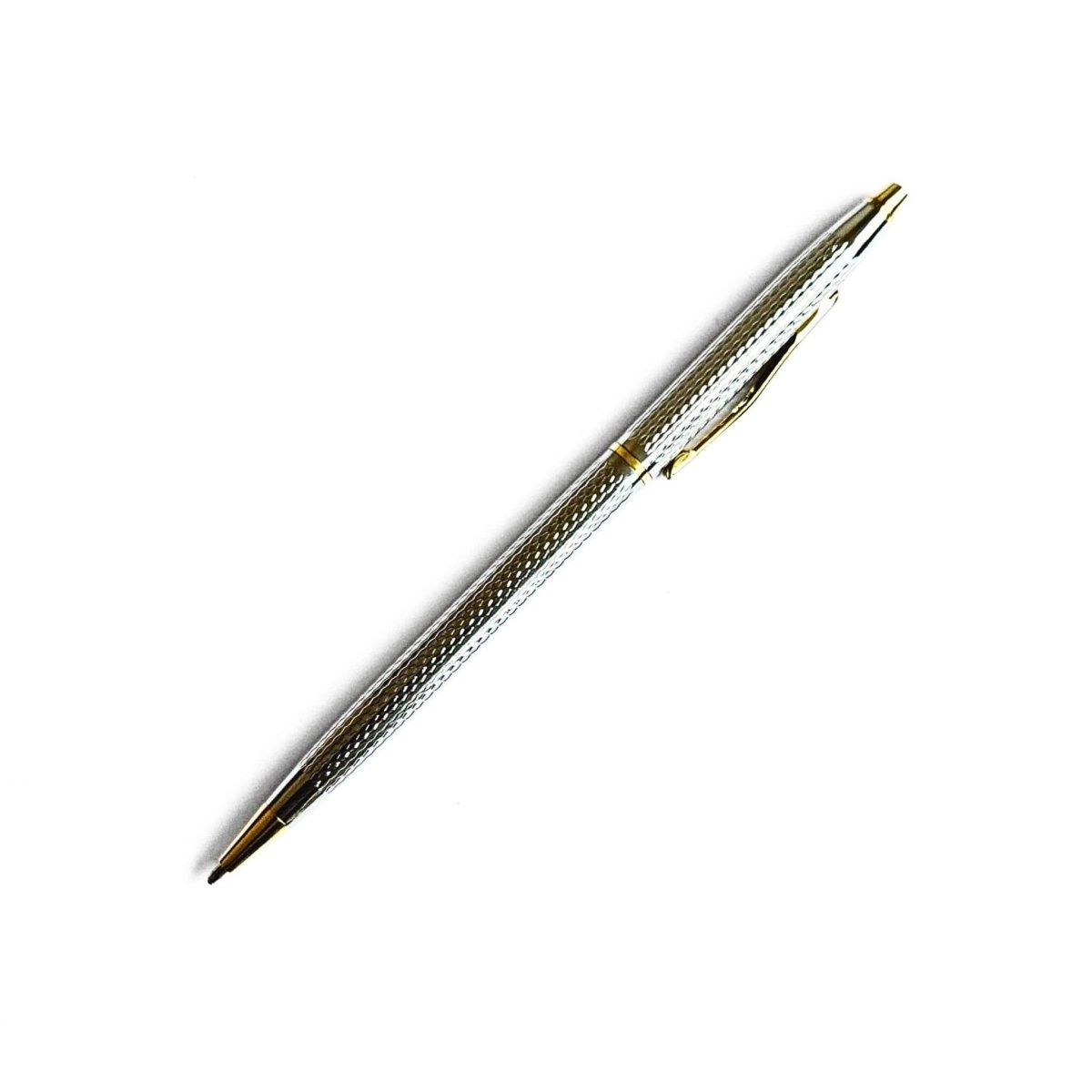 Silver pen with textured design on a white background