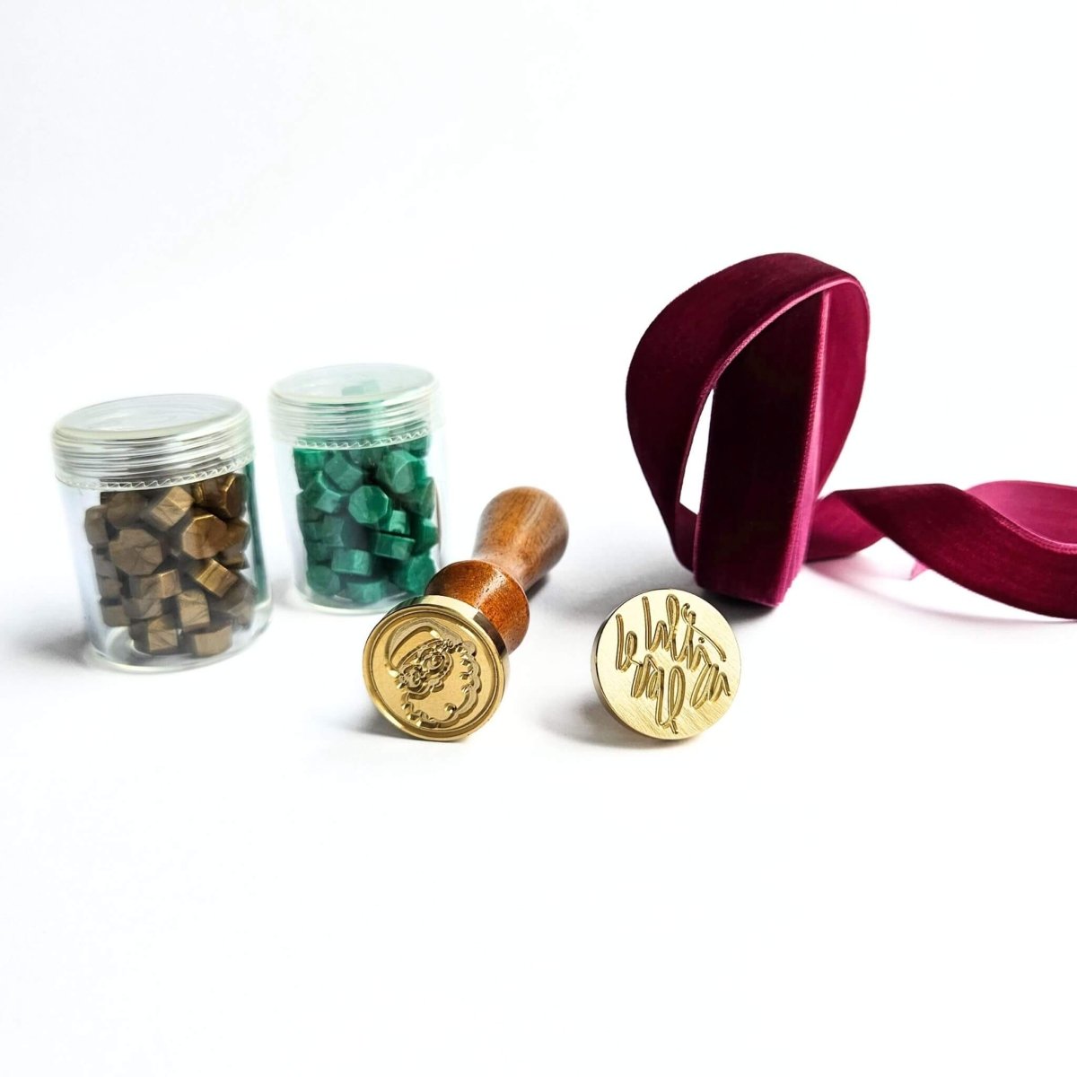 green and gold sealing wax beads with Christmas wax seals and purple ribbon