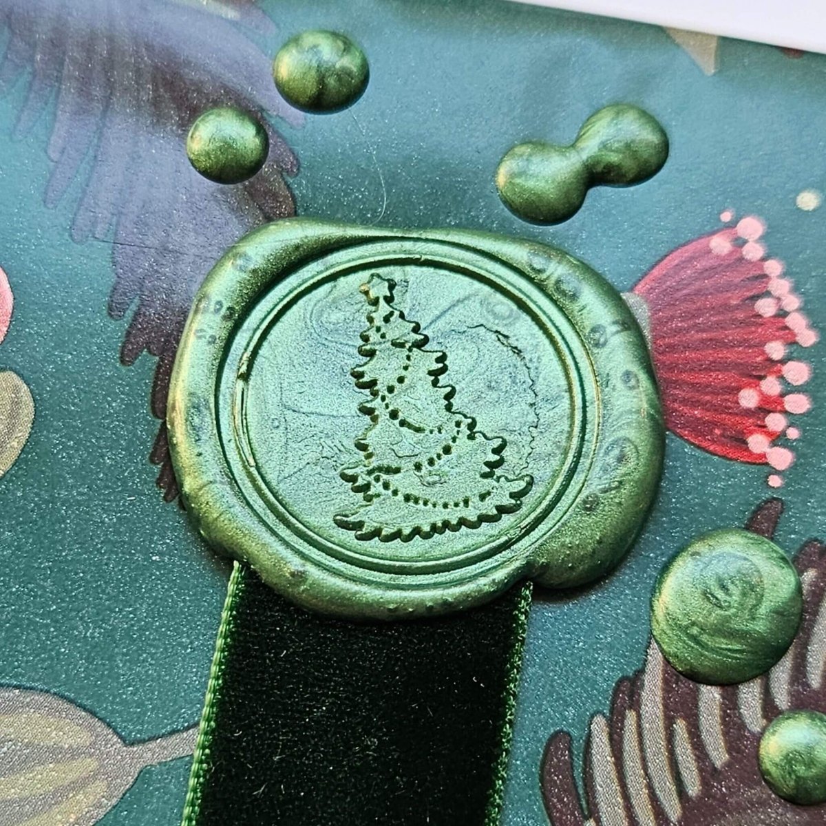 close up of Christmas tree wax seal