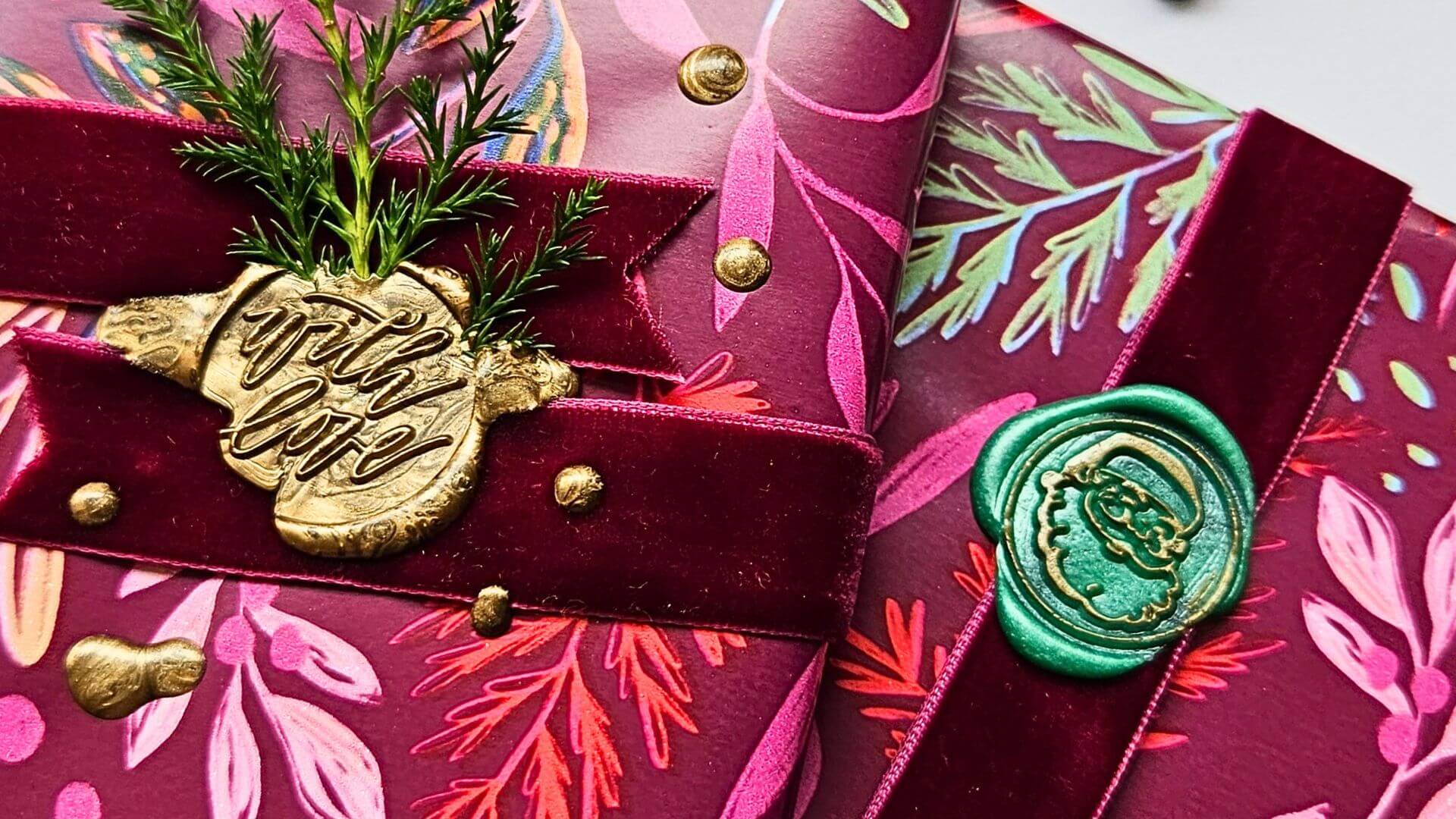 Christmas gifts with gold and green wax seals and velvet ribbon