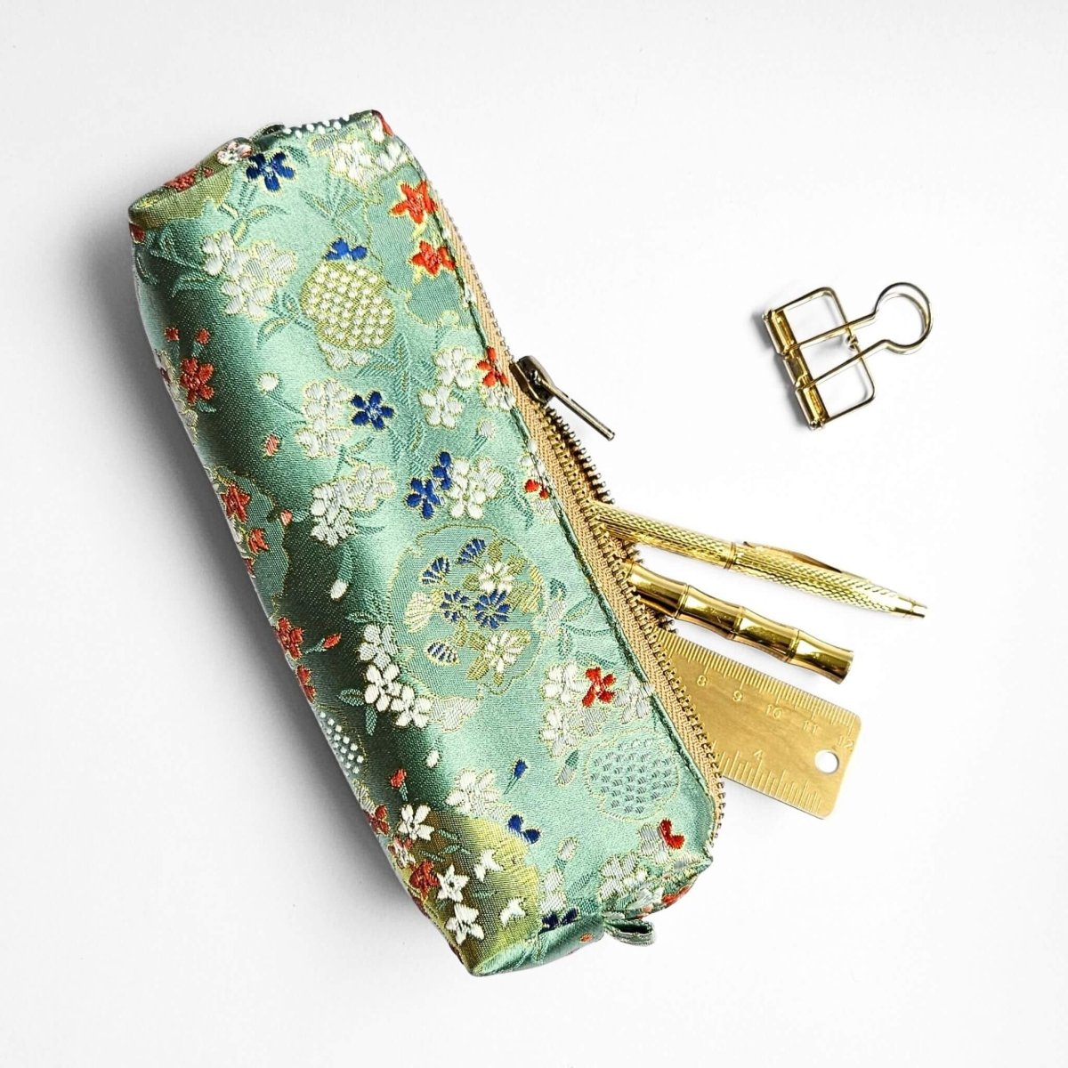 mint green floral pencil case with gold stationery