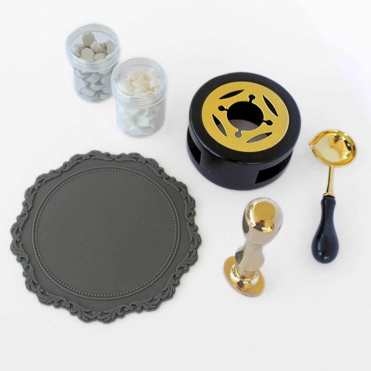 solid grass wax seal with Goddess design, grey wax seal mat, black and gold wax melting tove and spoon set and grey and white wax sealing beads