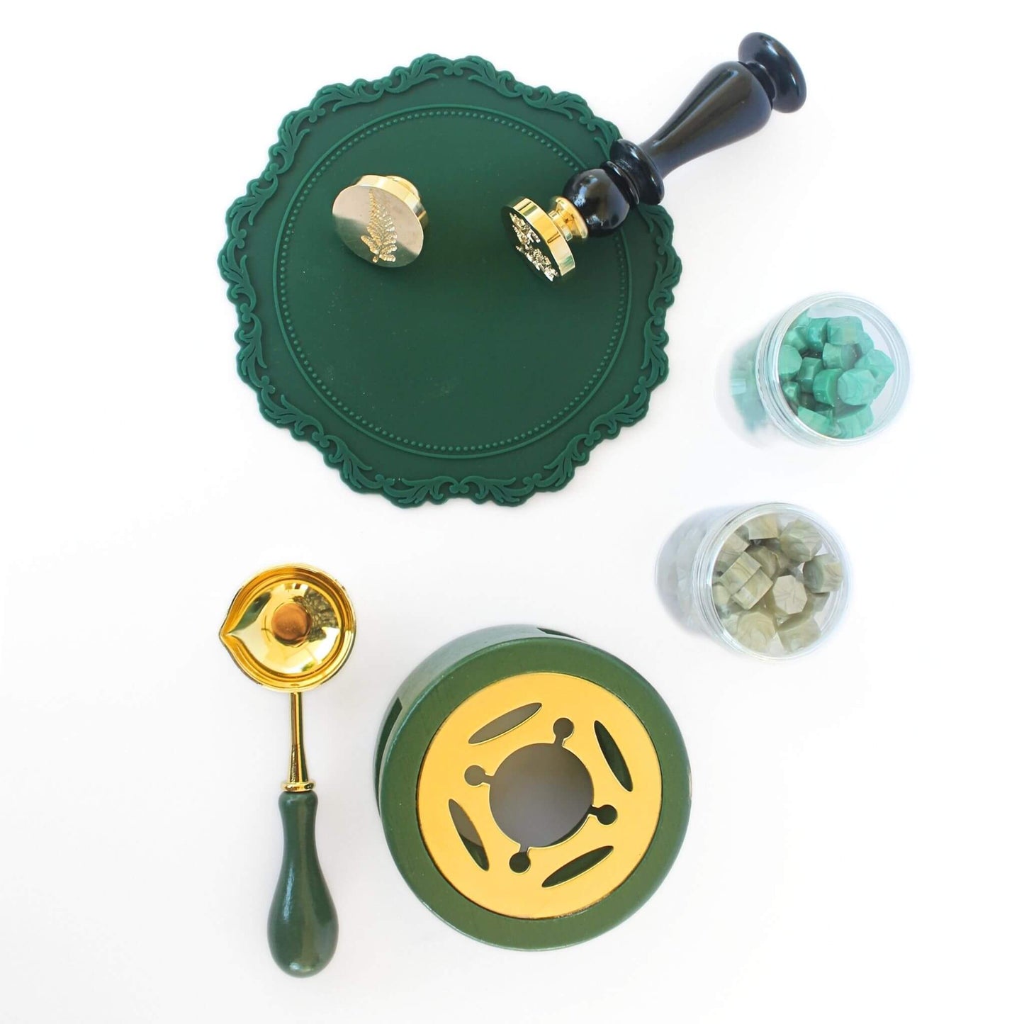 green themed wax seal kit with wax seals featuring botanical engravings and green wax sealing accessories
