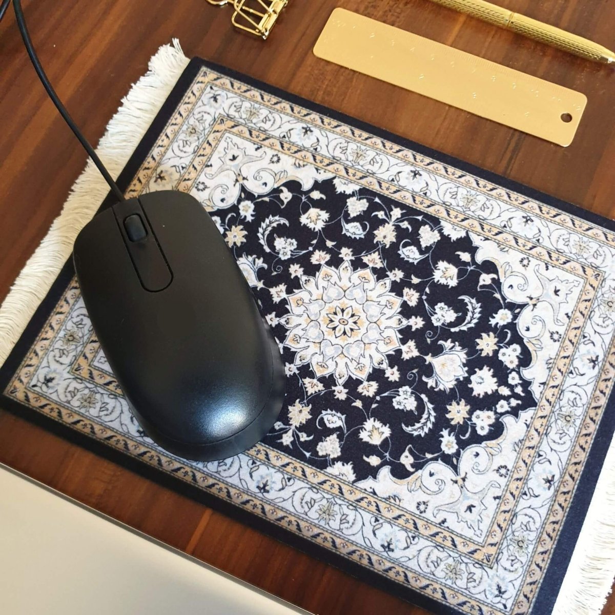 Bohemian rug mouse pad in neutral shades on desk with mouse on it