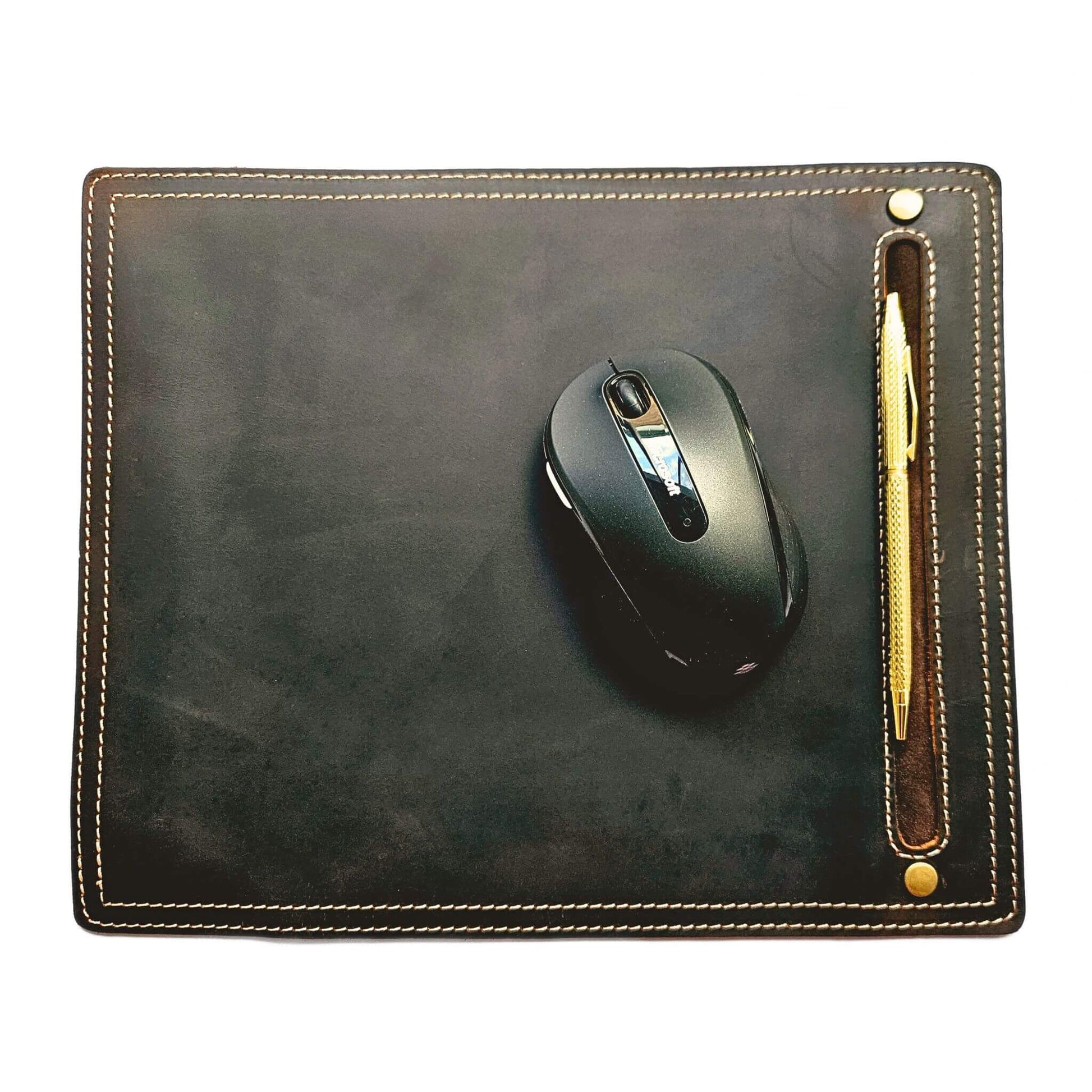 brown leather mouse pad with computer mouse and gold pen