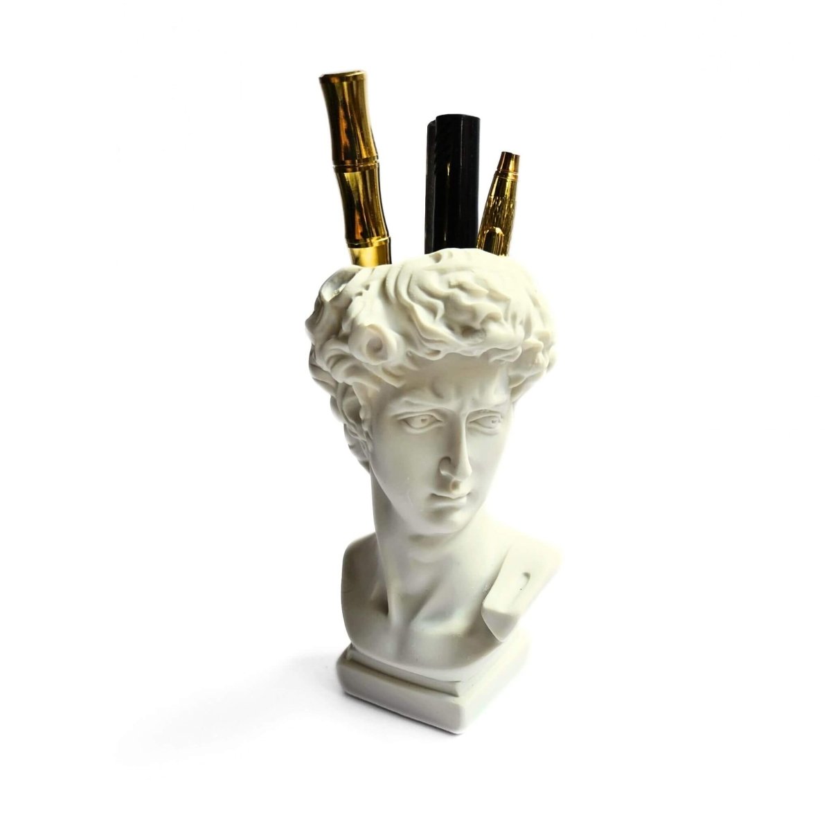 white Greek statue head pen holder with pens inside