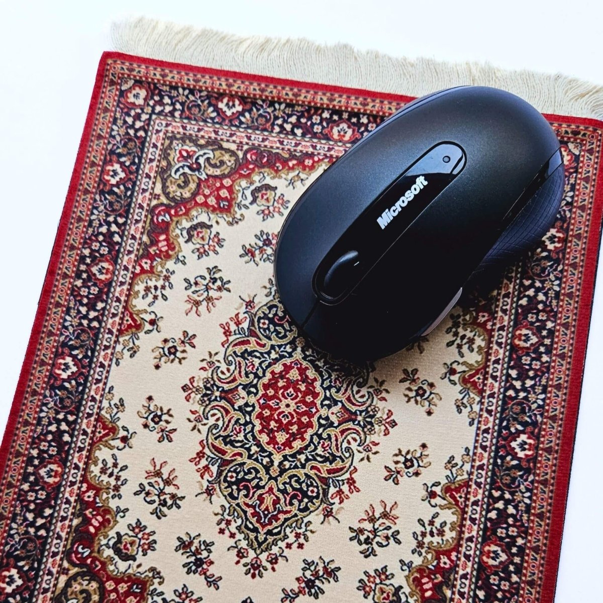 computer mouse on oriental rug mouse pad