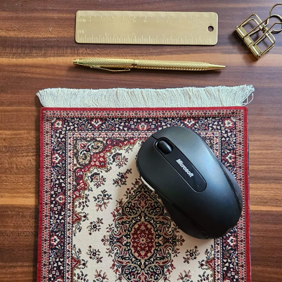 rug mouse pads on desk with computer mouse