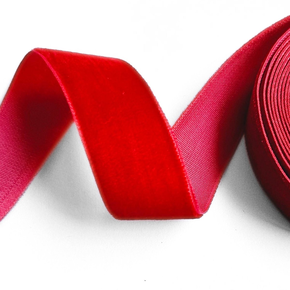 curled up red velvet ribbon up close