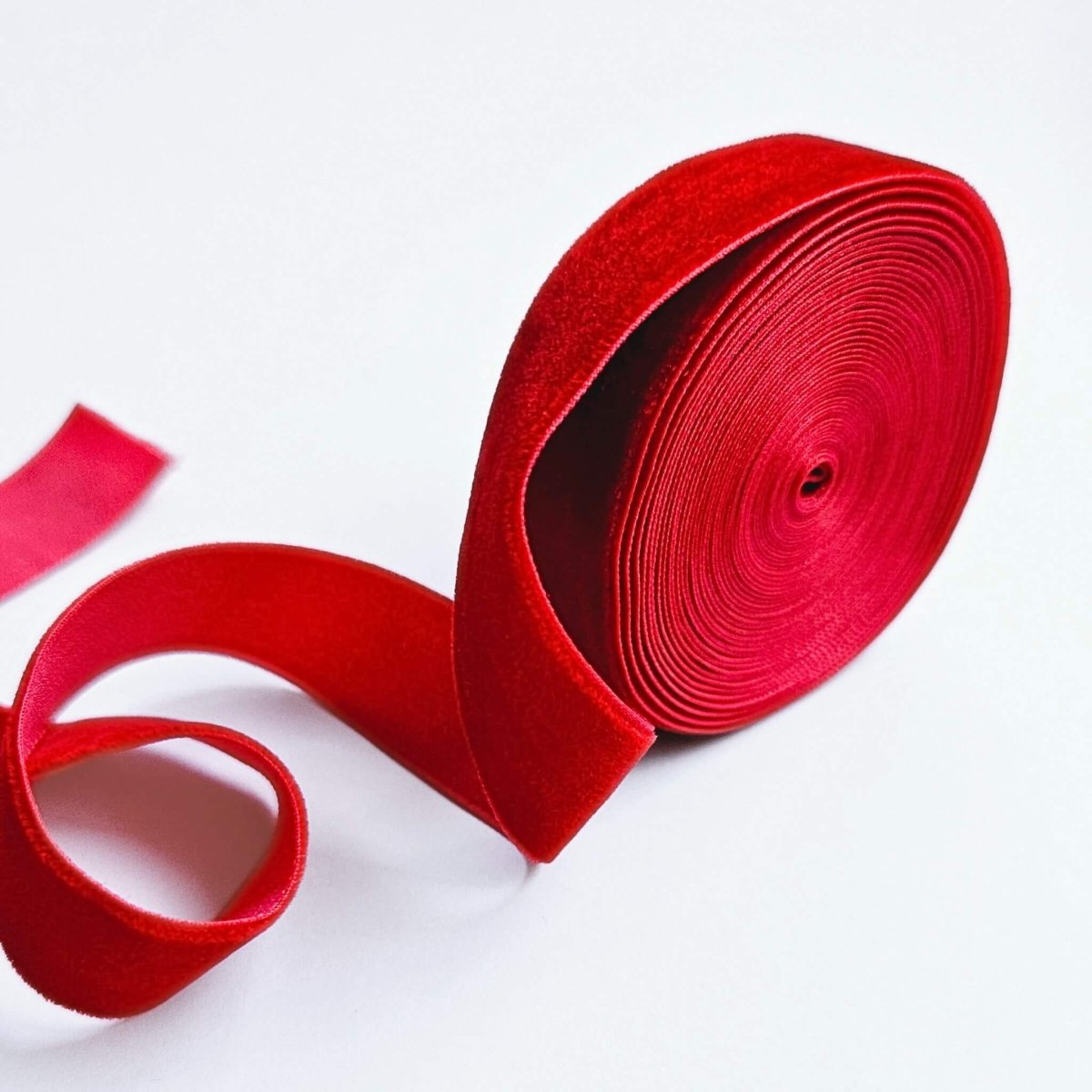 roll of bright red velvet ribbon