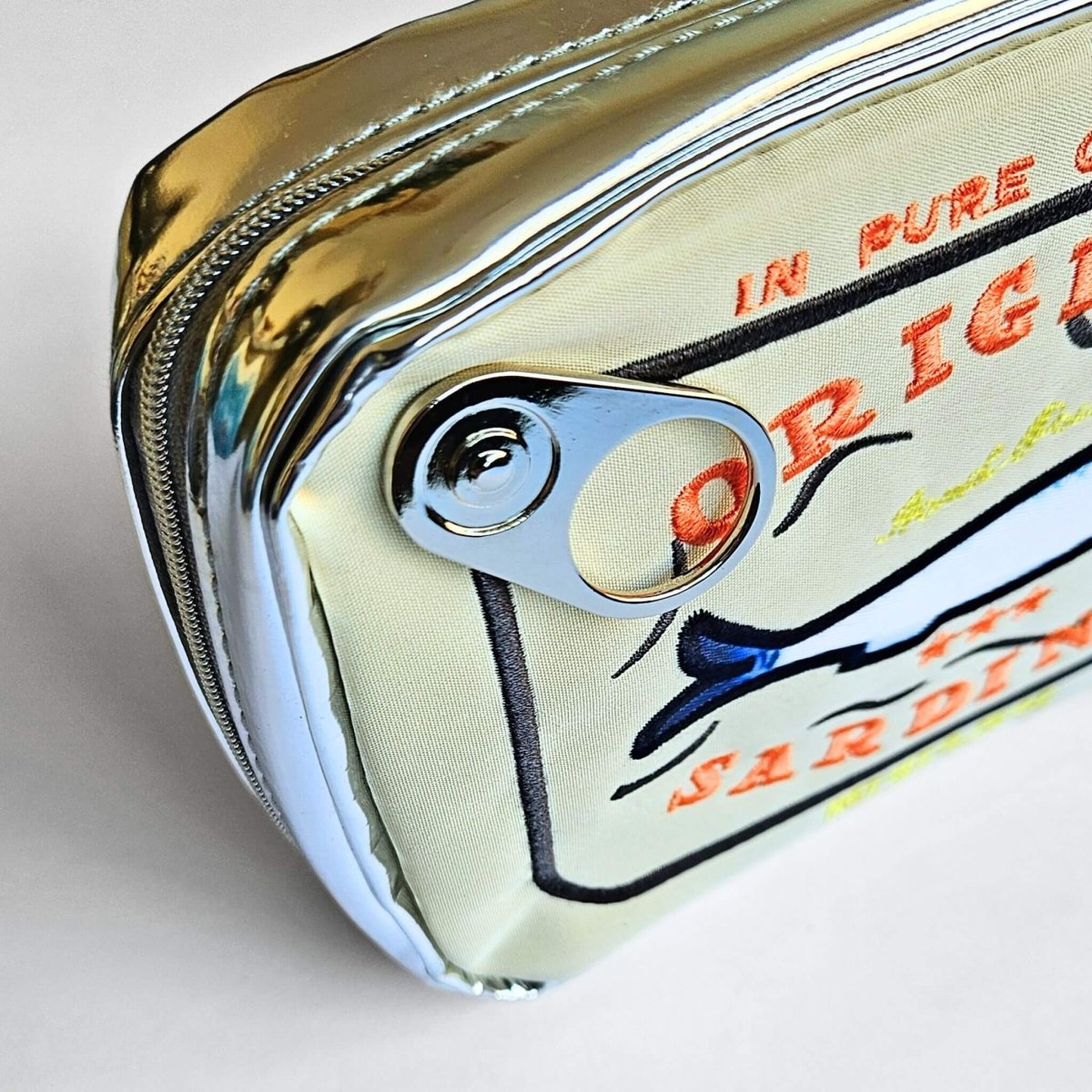 close up of ring pull on sardine tin pencil case