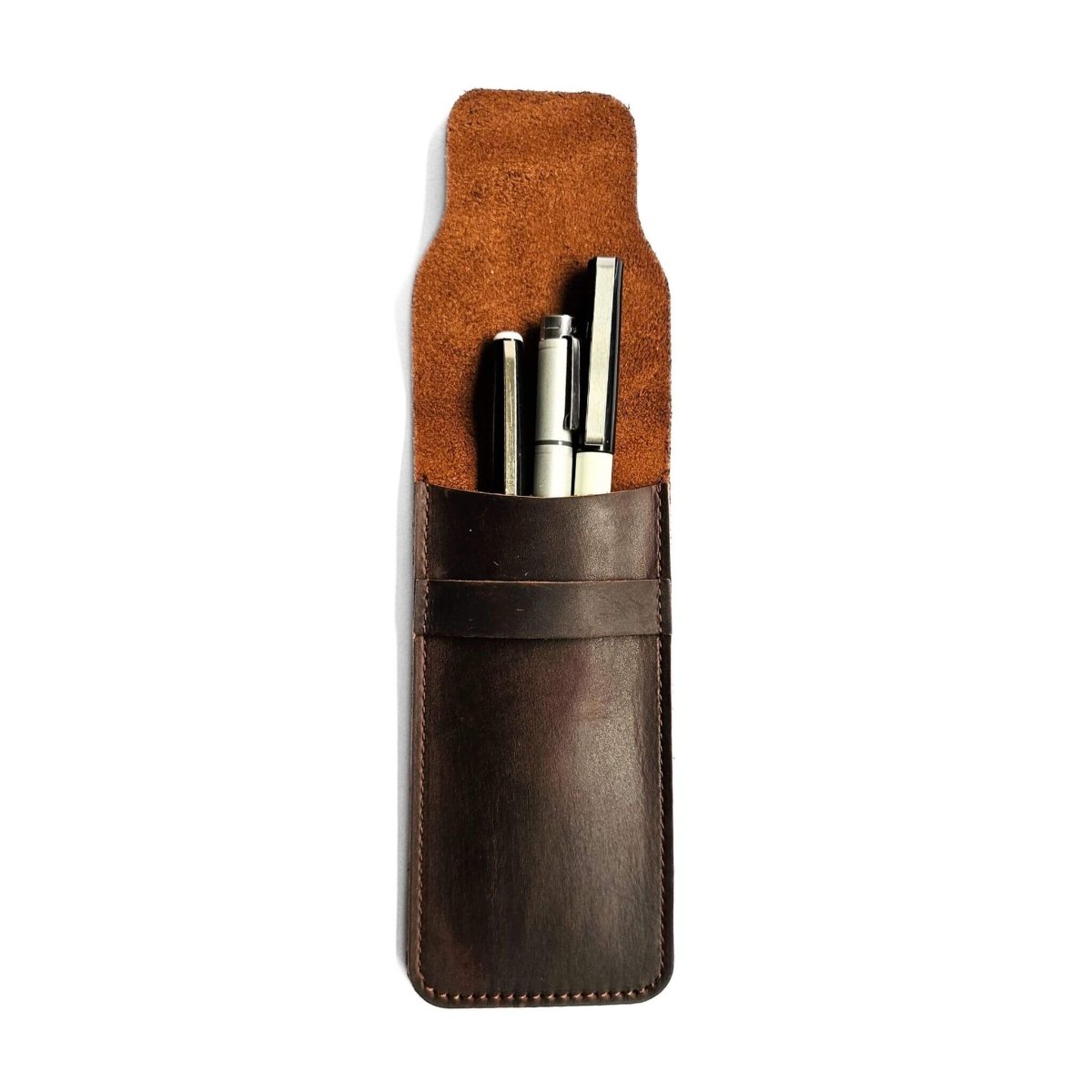 brown leather fountain pen case open with pens inside