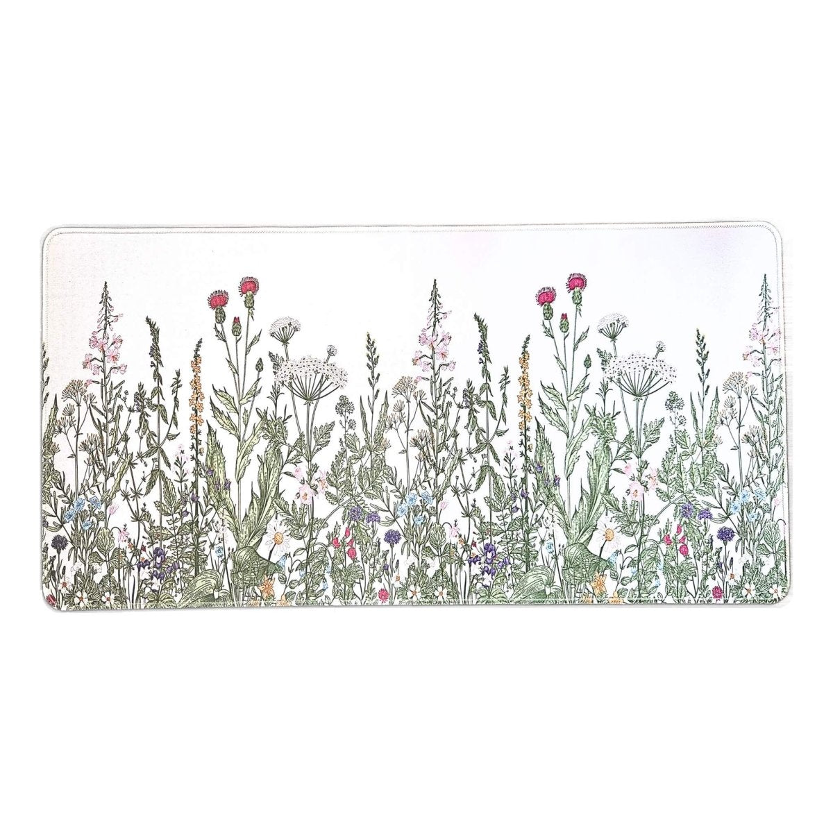 Rectangular desk mat with a design of wildflowers on a white background