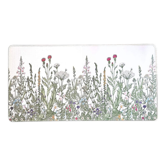 Rectangular desk mat with a design of wildflowers on a white background