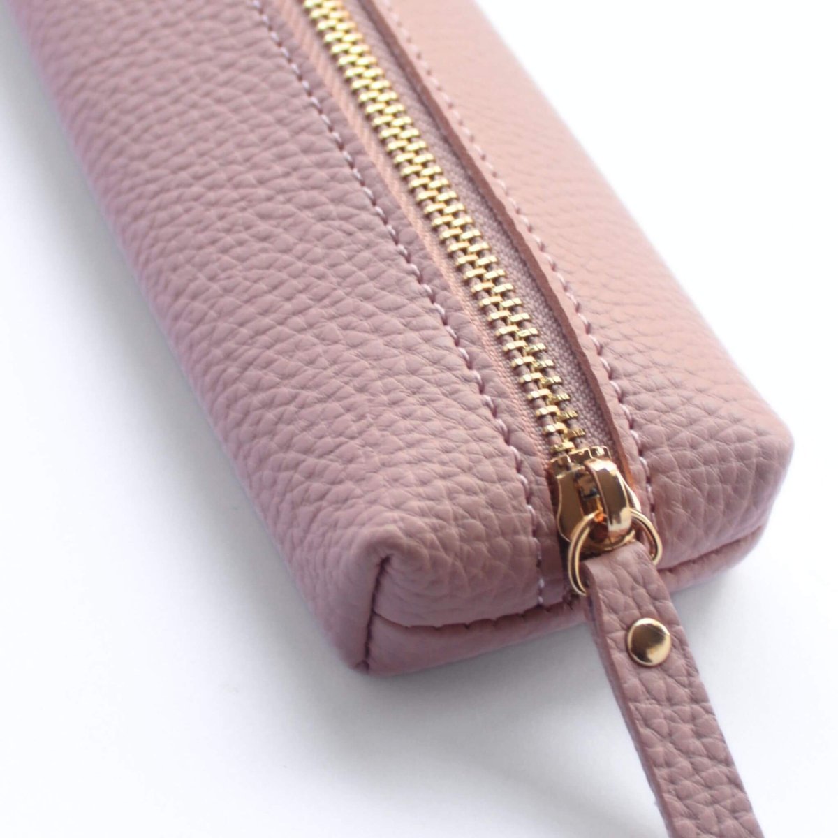 Small pink pencil case close up of gold zip