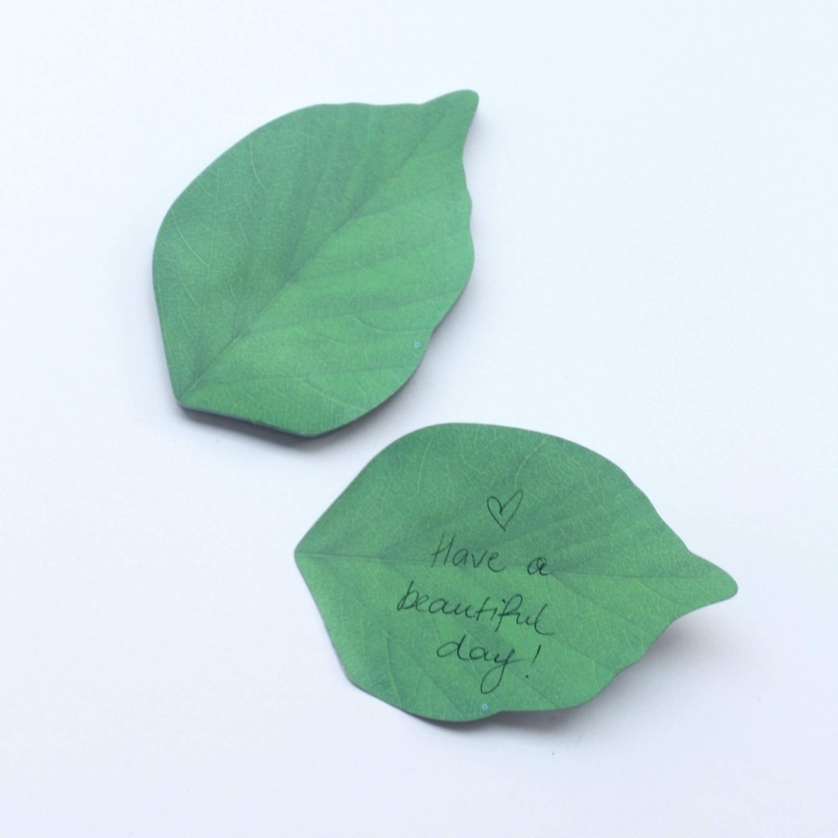 two leaf sticky notes with handwritten message